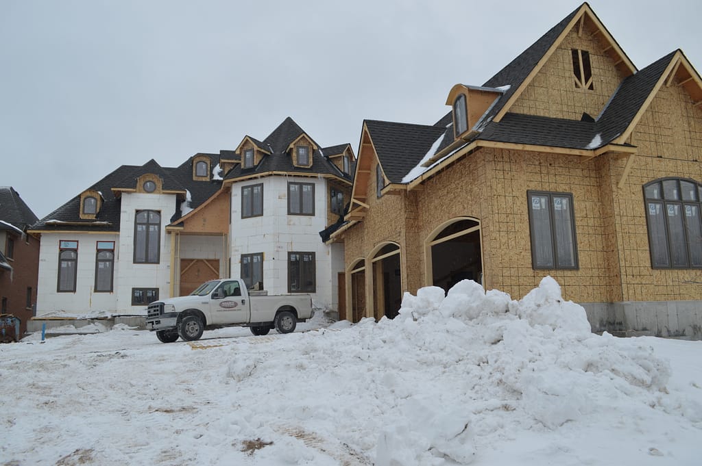 Stick frame custom home winter Custom home builder in the winter